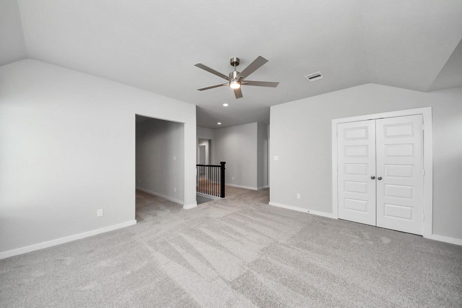 Ascend to relaxation in this fantastic game room! Ideal for both casual gatherings and adult gaming, it boasts plush carpet, lofty ceilings, custom paint, and ample windows for abundant natural light.