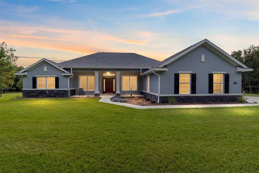 Front exterior of a new home in , Williston, FL, highlighting curb appeal (Image 22).