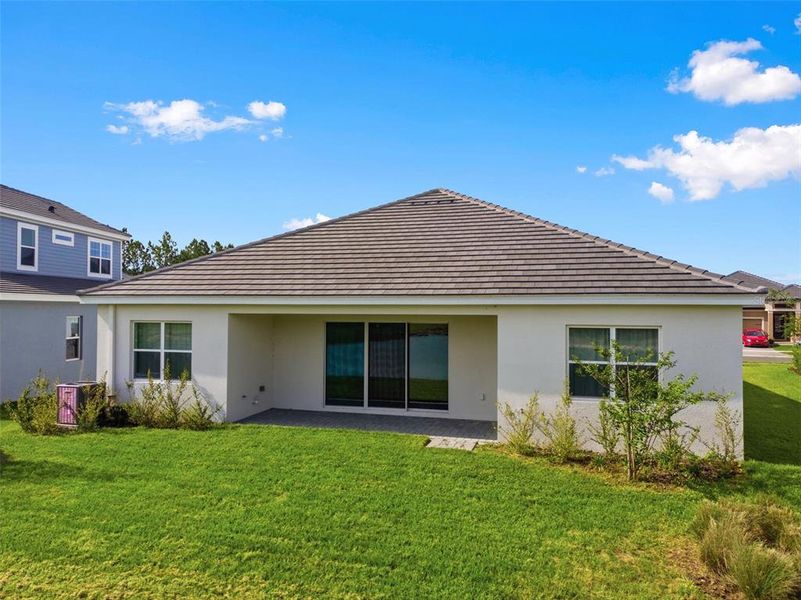 Exterior details and patio area of a home in Tamarack at Two Rivers, Zephyrhills (Image 34).