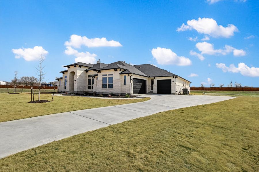 Representative exterior photo of a completed home built from the Avalon by Giddens Homes in Scofield Farms Estates, Georgetown, TX (Image 34).