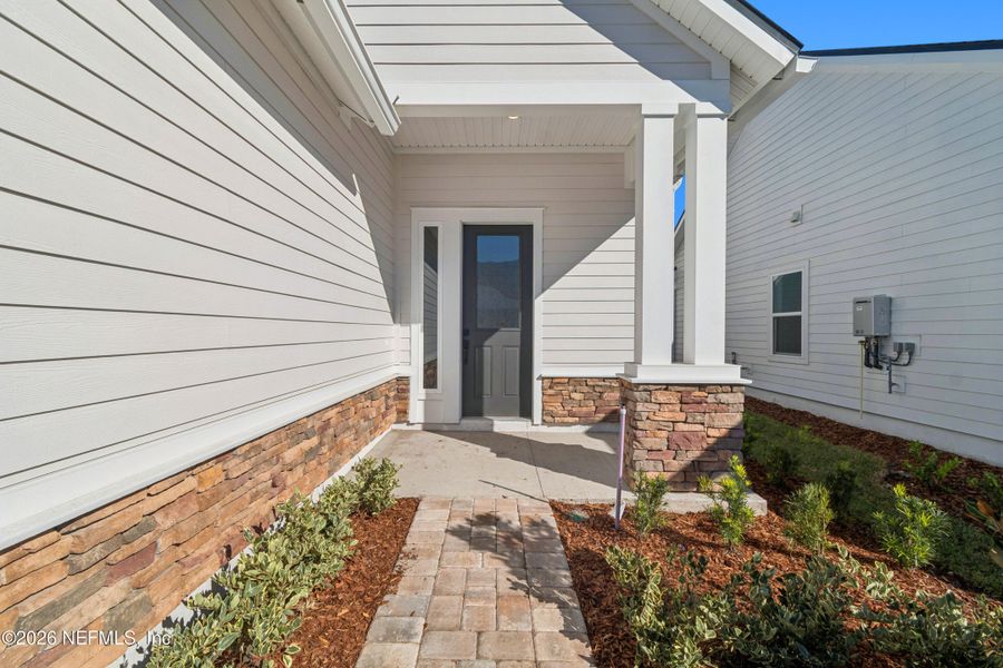 Exterior details and patio area of a home in Evergreen Island at Silverleaf - Executive, St. Augustine (Image 3).