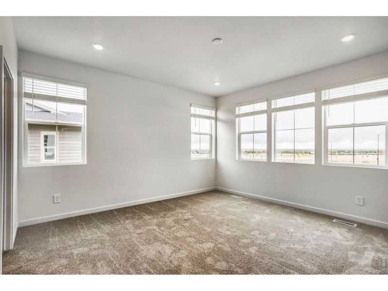 Spacious, unfurnished interior of a new home in Riano Ridge, Loveland (Image 9).