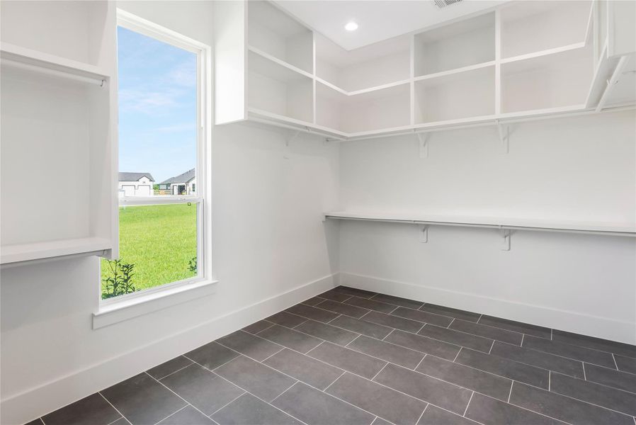 Walk in primary closet Walk in primary closet