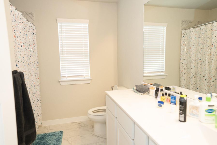 Furnished interior view inside a new home in Sunterra, Katy (Image 6).
