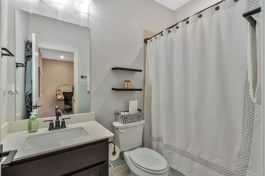 Bathroom with vanity and toilet