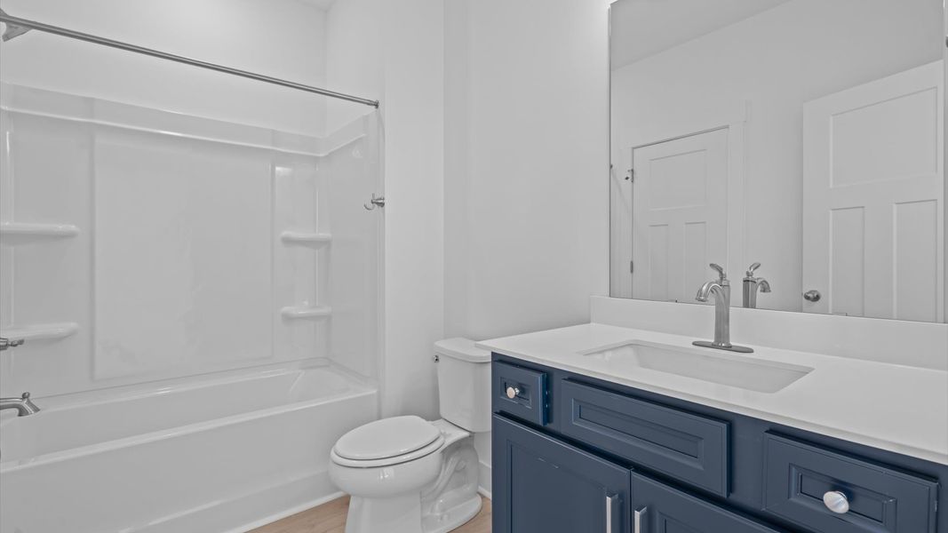 Refined hall bath with elevated finishes and a highly functional layout