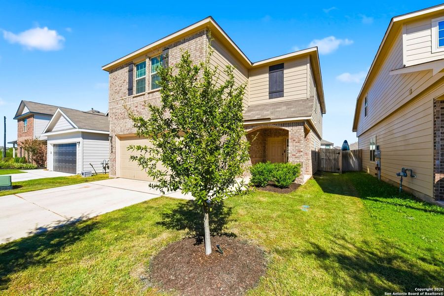 Front exterior of a new home in Abbott Place, St. Hedwig, TX, highlighting curb appeal (Image 27).