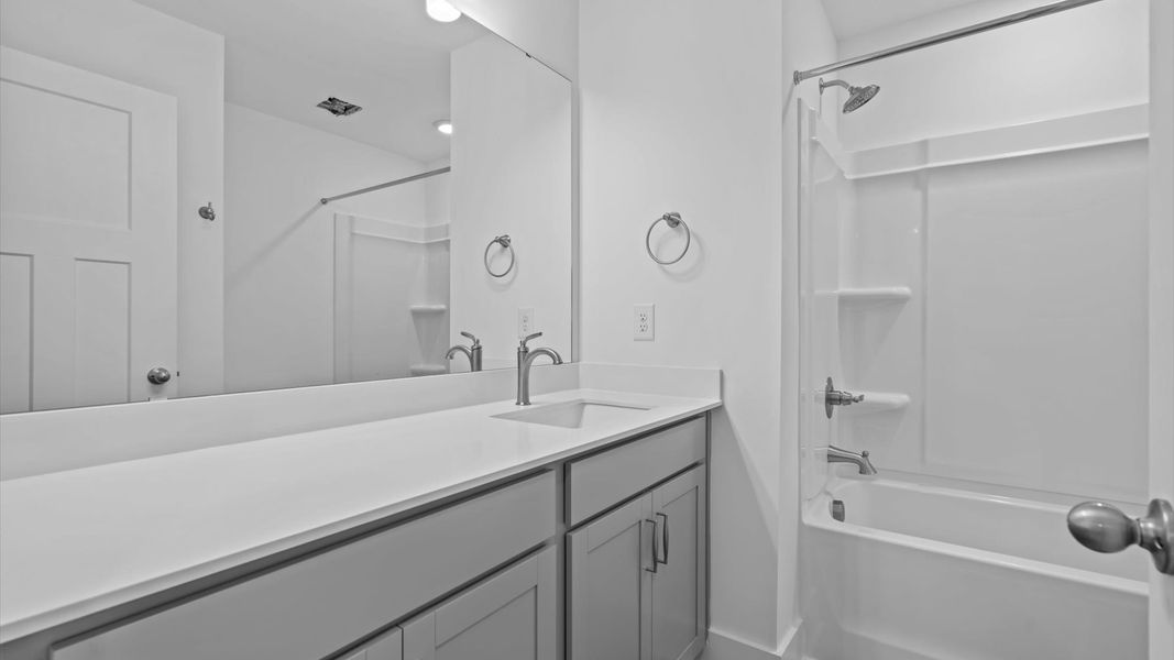 Well-appointed full bath with high standards of craftsmanship and everyday function at this townhome community in Anderson