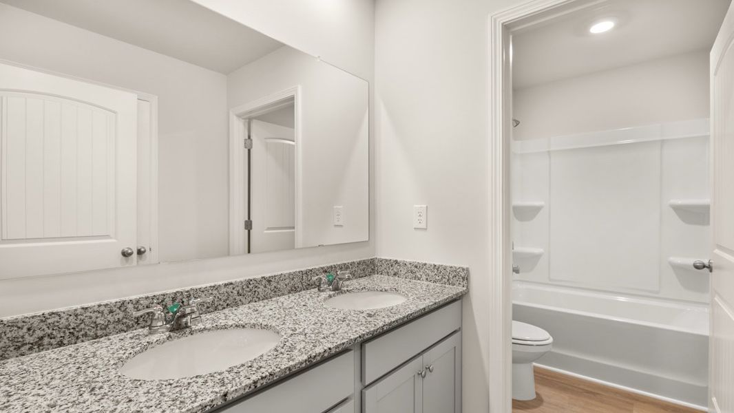 Representative furnished interior of a home built from the Halton by D.R. Horton in Northwoods at Mirror Lake, Villa Rica (Image 13).