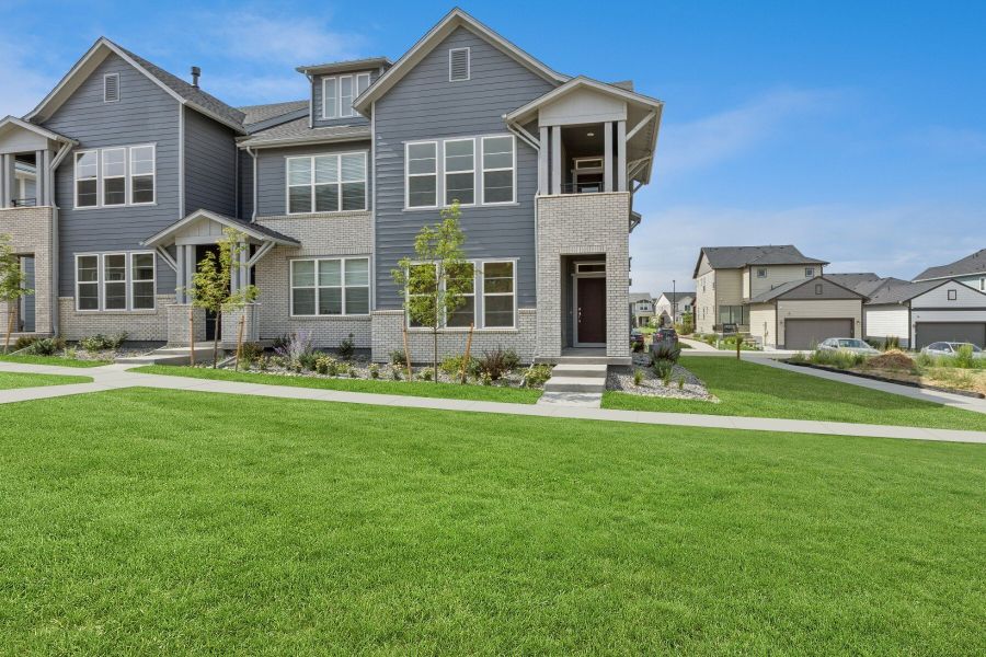 Front exterior of a new home in Kinston Mainstreet Townhomes, Loveland, CO, highlighting curb appeal (Image 20). Front exterior of a new home in Kinston Mainstreet Townhomes, Loveland, CO, highlighting curb appeal (Image 20).