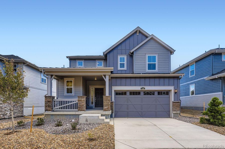 Exterior details and patio area of a home in Ken-Caryl Ranch: The Pioneer Collection, Littleton (Image 1).