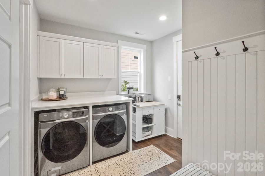 Just inside the house from the garage is the laundry room, coat closet (large, walk-in) and a drop zone for all your stuff!