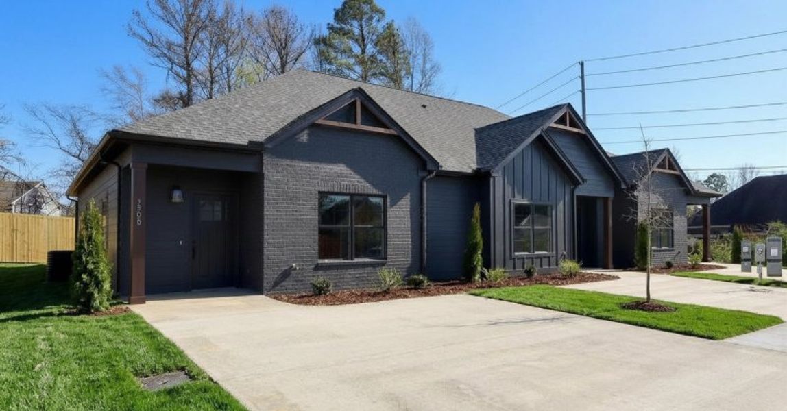 Front exterior of a new home in The Nassau, Chattanooga, TN, highlighting curb appeal (Image 21). Front exterior of a new home in The Nassau, Chattanooga, TN, highlighting curb appeal (Image 21).