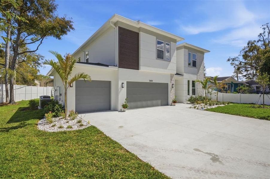 Front exterior of a new home in , Tampa, FL, highlighting curb appeal (Image 27).