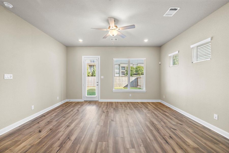 The room is accented with rich hardwood flooring and freshly painted neutral walls, creating a warm, inviting atmosphere. The room is accented with rich hardwood flooring and freshly painted neutral walls, creating a warm, inviting atmosphere.