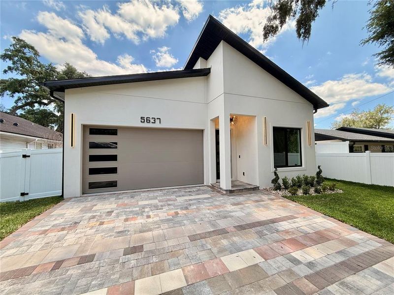 Front exterior of a new home in , Orlando, FL, highlighting curb appeal (Image 27).