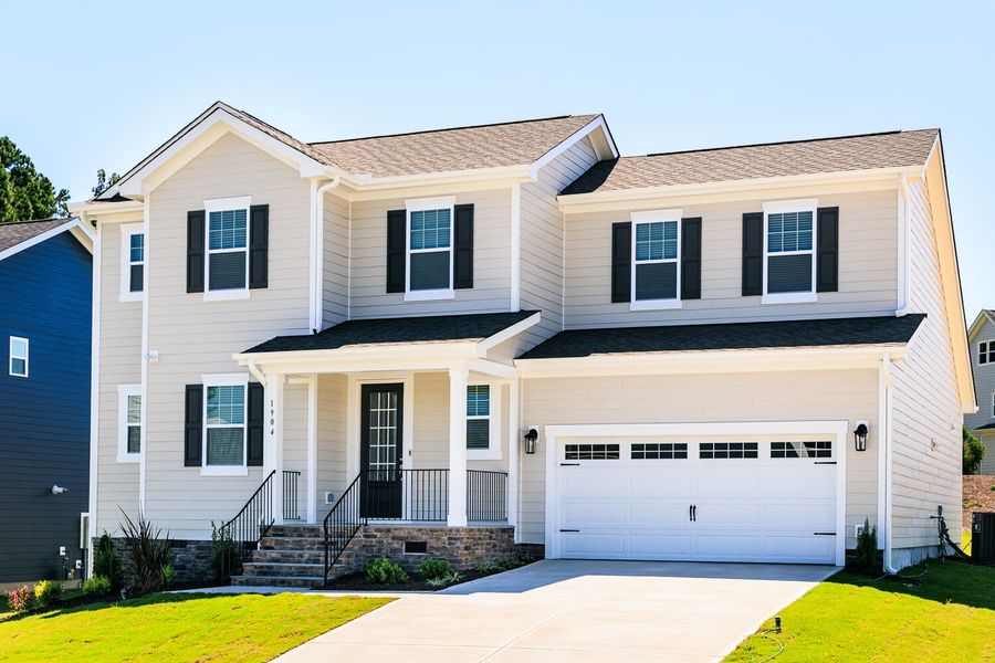 Front exterior of a new home in High Grove Oaks, Fuquay Varina, NC, highlighting curb appeal (Image 20). Front exterior of a new home in High Grove Oaks, Fuquay Varina, NC, highlighting curb appeal (Image 20).