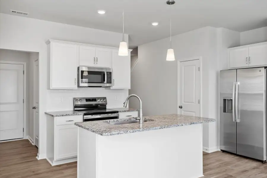 Furnished interior view inside a new home in West Main Townhomes, Sanford (Image 7).