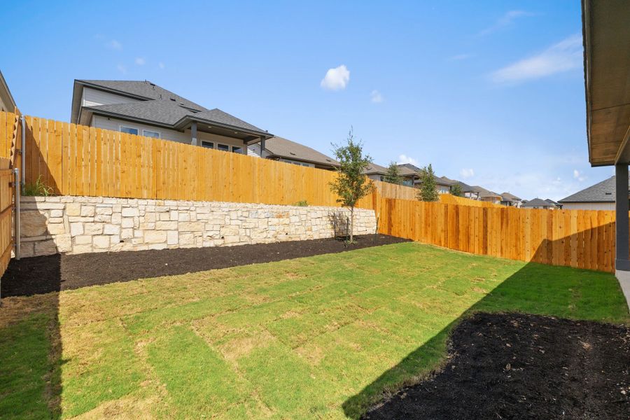 Exterior details and patio area of a home in Heritage, Dripping Springs (Image 32).