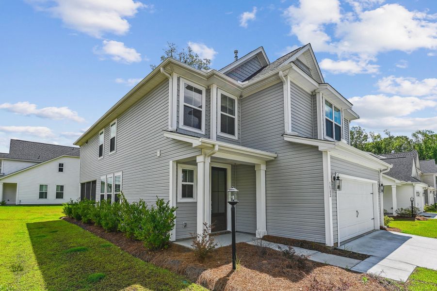 Front exterior of a new home in Windsor Crossing, North Charleston, SC, highlighting curb appeal (Image 21). Front exterior of a new home in Windsor Crossing, North Charleston, SC, highlighting curb appeal (Image 21).