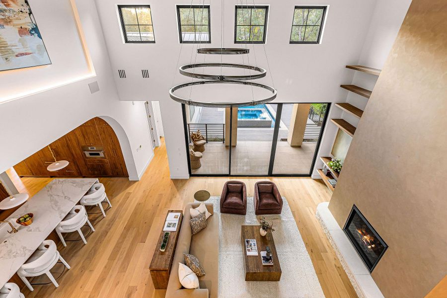 Exposed timber beams and hardwood flooring frame this elevated overlook with clean architectural lines.