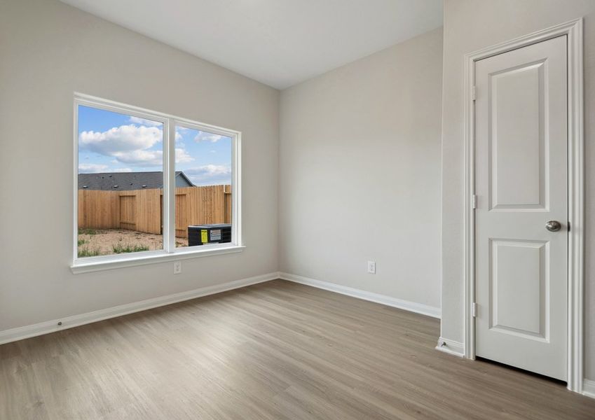 Dining room with a large window facing the backyard Dining room with a large window facing the backyard