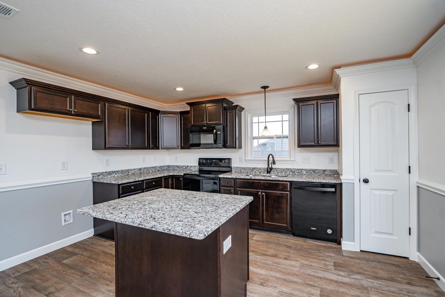 Representative furnished interior of a home built from the Sumter by Enchanted Homes in Lonesome Dove, San Antonio (Image 20).