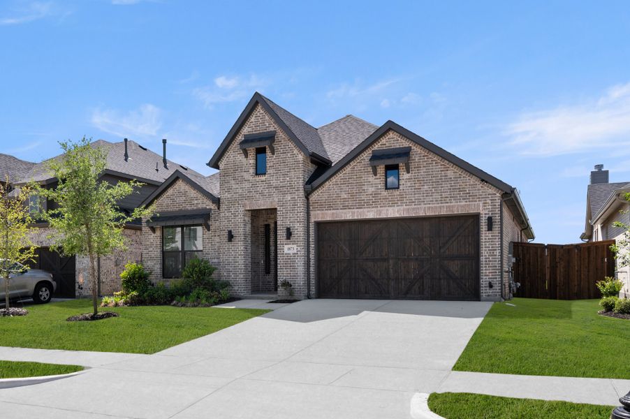 Front exterior of a new home in Bridgewater, Midlothian, TX, highlighting curb appeal (Image 2). Front exterior of a new home in Bridgewater, Midlothian, TX, highlighting curb appeal (Image 2).
