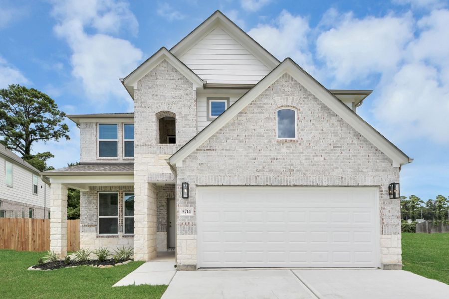 This home boasts lush green grass and meticulous landscaping. Its premium elevation showcases an exquisite blend of brick and stone features, complemented by modern coach lighting. This home boasts lush green grass and meticulous landscaping. Its premium elevation showcases an exquisite blend of brick and stone features, complemented by modern coach lighting.