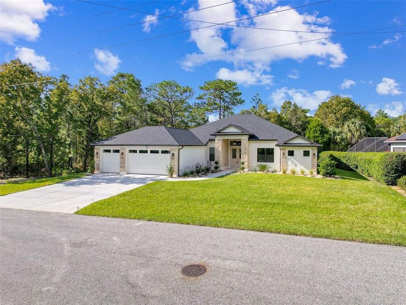 Front exterior of a new home in , Homosassa, FL, highlighting curb appeal (Image 30). Front exterior of a new home in , Homosassa, FL, highlighting curb appeal (Image 30).