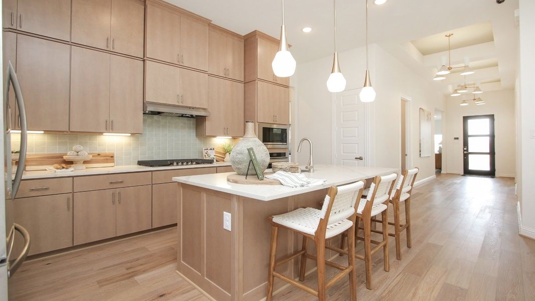Representative furnished interior of a home built from the Juniper by Brightland Homes in Sunterra, Katy (Image 4).