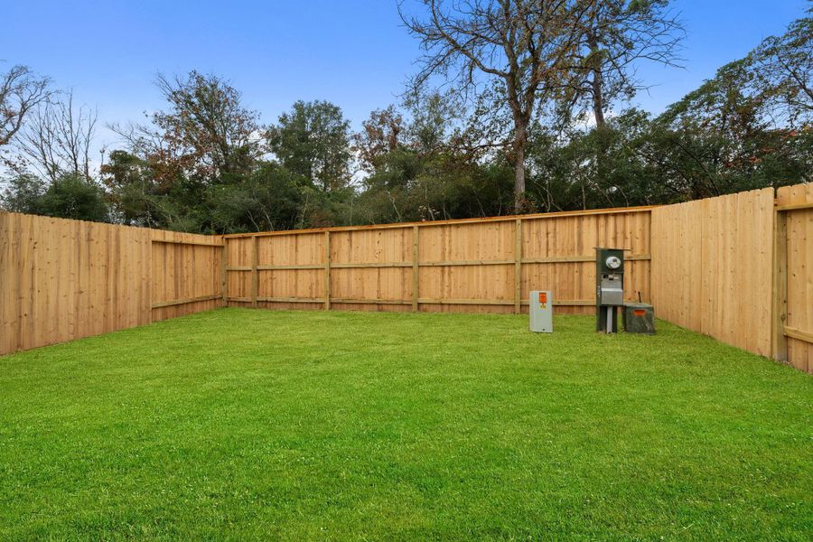 Exterior details and patio area of a home in Woodforest, Montgomery (Image 3).