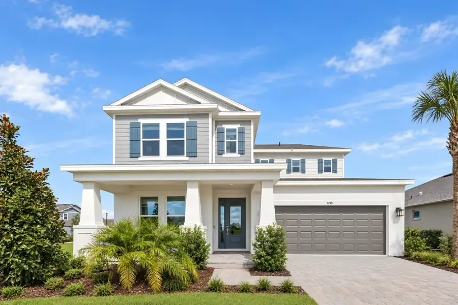 Front exterior of a new home in Center Lake Ranch Community Group Page, St. Cloud, FL, highlighting curb appeal (Image 26).