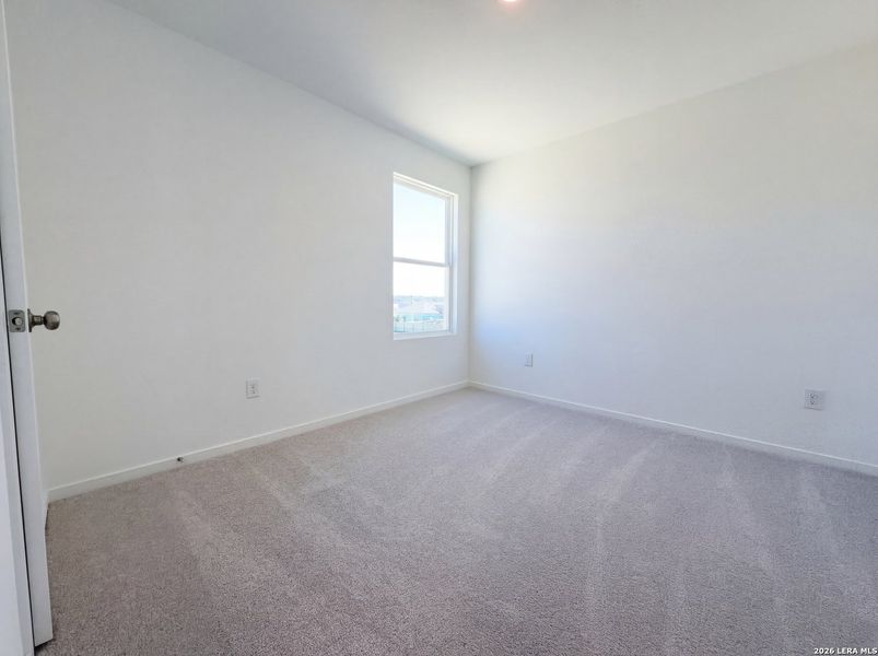 Spacious, unfurnished interior of a new home in Hunters Ranch, San Antonio (Image 9).