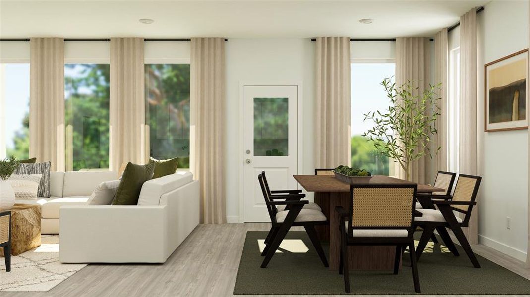 Dining space with plenty of natural light and light wood-type flooring