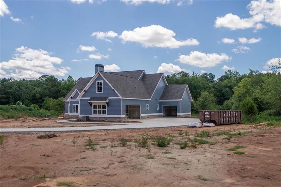 Front exterior of a new home in , Social Circle, GA, highlighting curb appeal (Image 1).