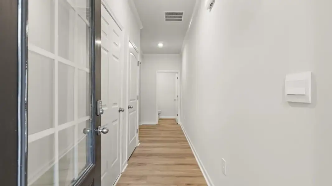 Spacious, unfurnished interior of a new home in Waypoint, Flowery Branch (Image 24).
