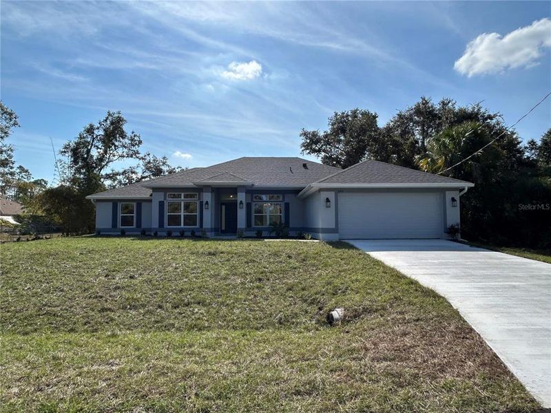 Front exterior of a new home in North Port, North Port, FL, highlighting curb appeal (Image 13). Front exterior of a new home in North Port, North Port, FL, highlighting curb appeal (Image 13).