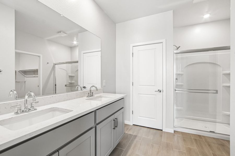 A bathroom with a glass shower.