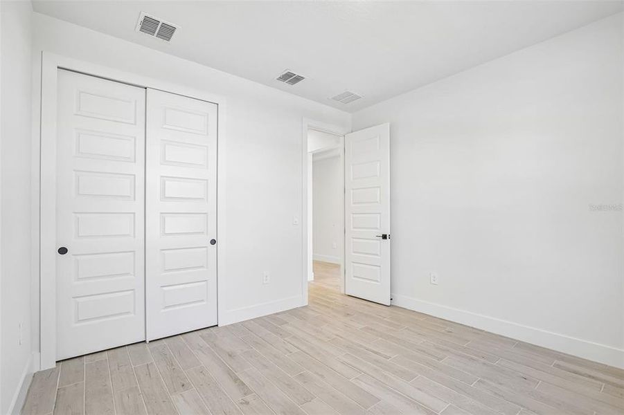 Spacious, unfurnished interior of a new home in Magnolia Bay - Reserve Series, Nokomis (Image 16).