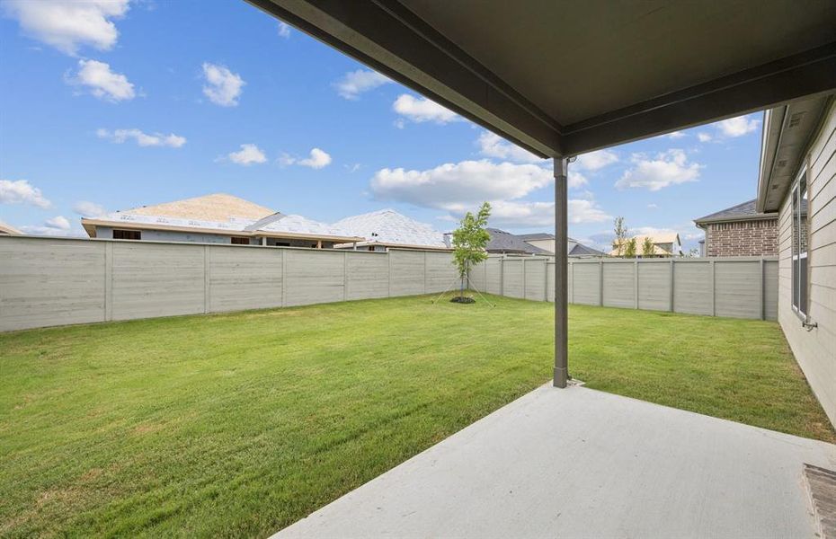 Oversized yard with covered patio *Real home pictured