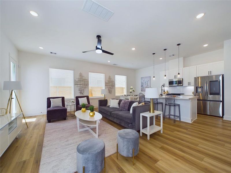 View of open-concept 1st floor, as you enter the home.  These are photos from our staged/furnished model home.  All homes are the same floor plan.