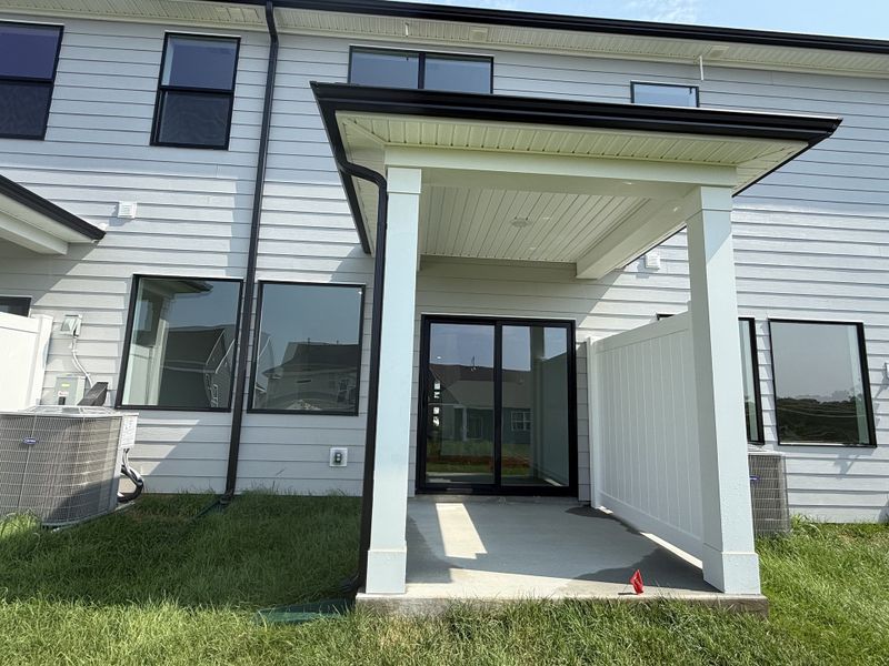 Exterior details and patio area of a home in Nexus Townhomes, Gallatin (Image 23). Exterior details and patio area of a home in Nexus Townhomes, Gallatin (Image 23).