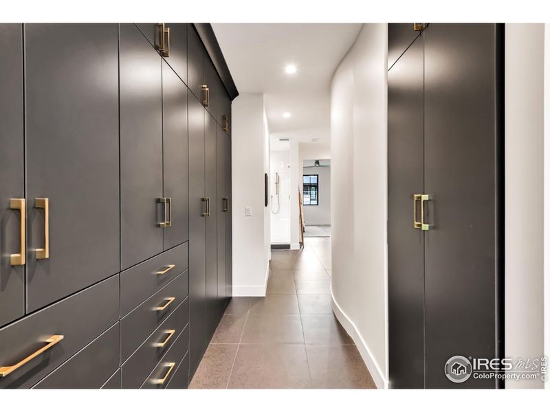 Custom, Euro style closet system keeps the primary clean and uncluttered