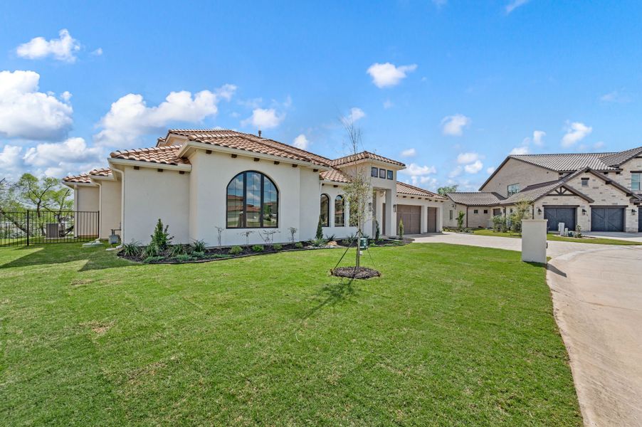 Front exterior of a new home in The Resort on Eagle Mt. Lake, Fort Worth, TX, highlighting curb appeal (Image 27). Front exterior of a new home in The Resort on Eagle Mt. Lake, Fort Worth, TX, highlighting curb appeal (Image 27).