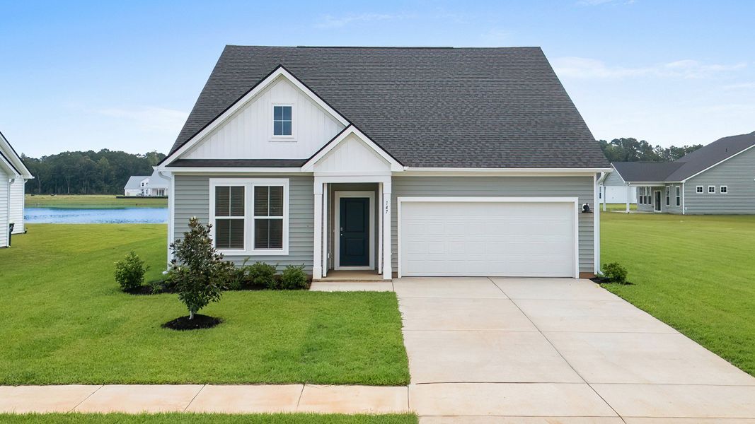 Avondale Elevation 2 at Chestnut Farms in Longs, SC featuring charming front porch, gable roofline, and spacious driveway Avondale Elevation 2 at Chestnut Farms in Longs, SC featuring charming front porch, gable roofline, and spacious driveway