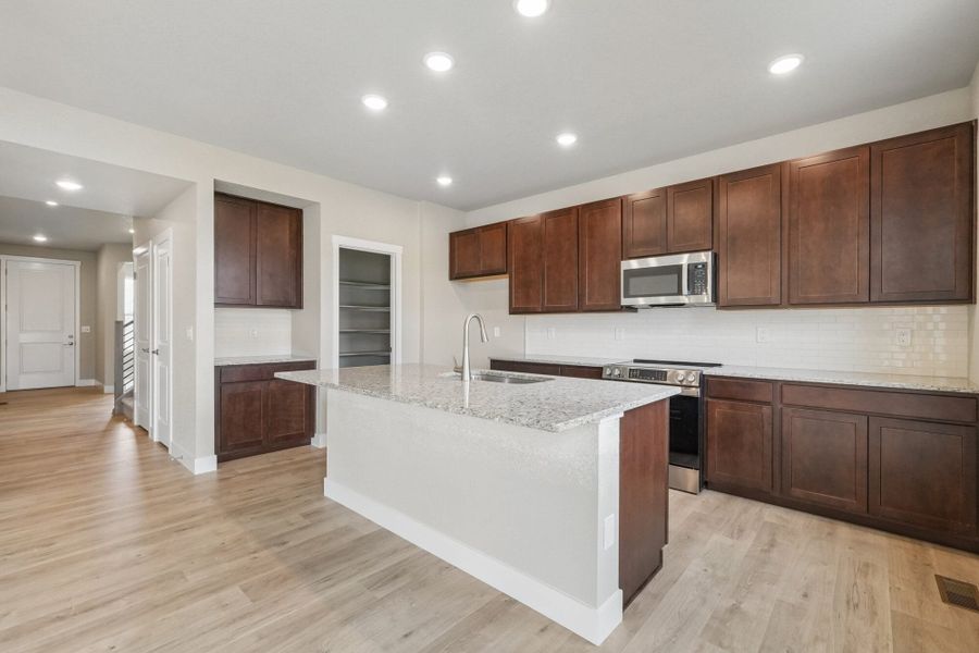 Furnished interior view inside a new home in The Trails at Aspen Ridge, Colorado Springs (Image 8).