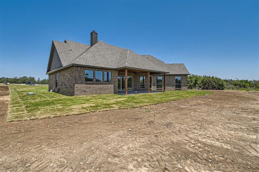 Rear view of property with a patio