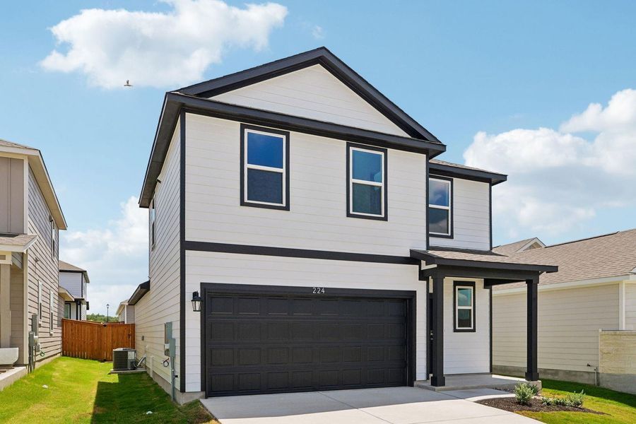 Front exterior of a new home in Eastwood at Sonterra, Jarrell, TX, highlighting curb appeal (Image 20). Front exterior of a new home in Eastwood at Sonterra, Jarrell, TX, highlighting curb appeal (Image 20).