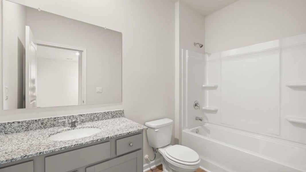 Furnished interior view inside a new home in Northwoods at Mirror Lake, Villa Rica (Image 7).